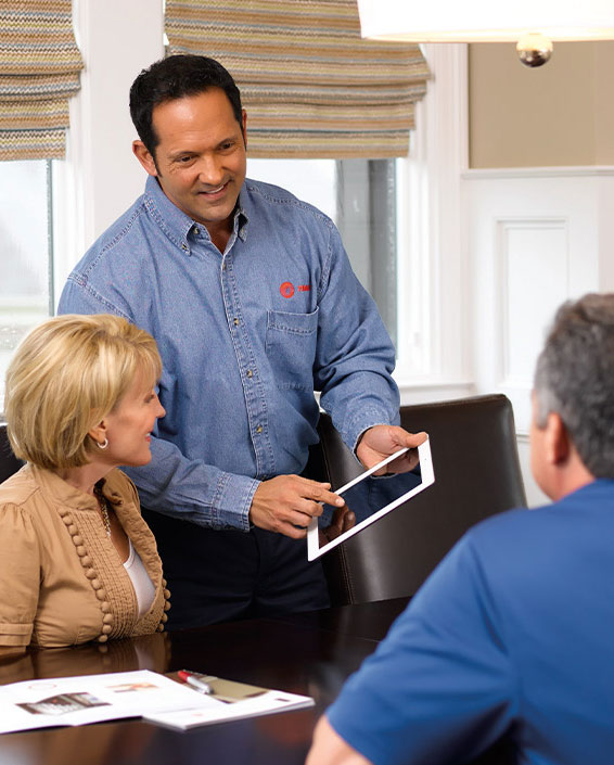 technician speaking to couple